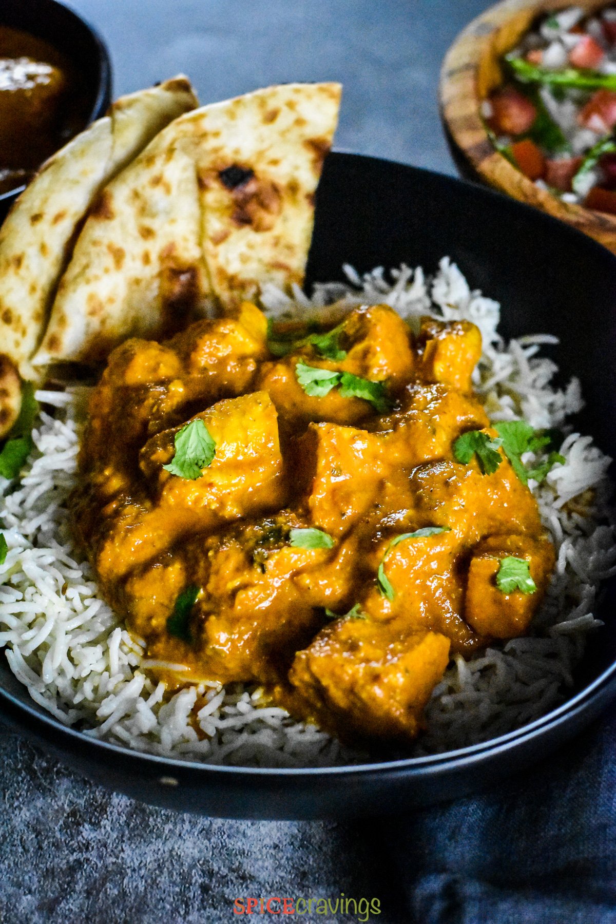 Diced cubes of chicken tossed in tikka masala curry, served over cumin rice