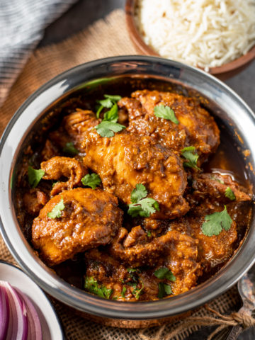Chicken vindaloo curry served with cumin rice