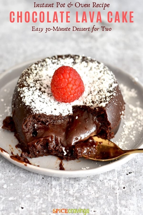 Melted chocolate lava cake topped with icing sugar and a raspberry