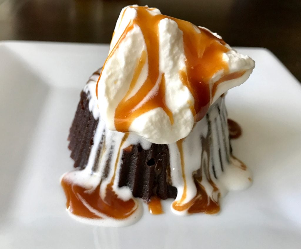 Chocolate Lava Cake served with whipped cream and caramel sauce