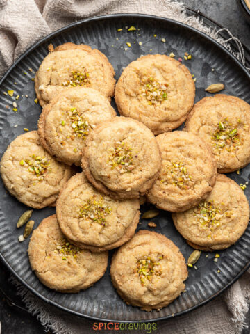 This healthier version of Nankhatai or Eggless Almond Spice Cookies substitutes half the all-purpose flour with whole wheat flour and adds almond flour, which bumps up the protein & almond flavor. The cardamom and nutmeg bring this cookie to life with a touch of spice. They make the perfect accompaniment to a cup of tea or coffee! #food #foodie #foodblogger #delicious #recipe #instantpot #recipes #easyrecipe #cuisine #30minutemeal #instagood #foodphotography #tasty #indian