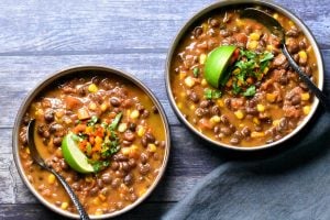 two bowls of Vegan black bean chili made in the pressure cooker