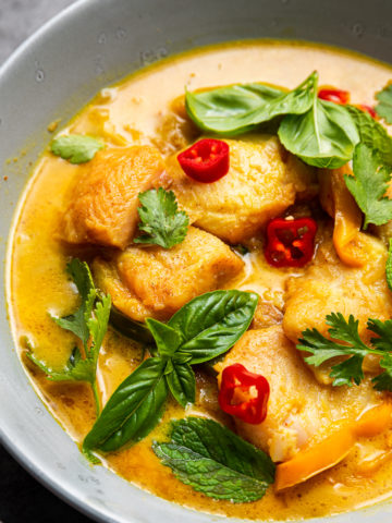 Fish Coconut Curry by Spice Cravings is a light fish prepared in a coconut milk broth with aromatics and tons of curry leaves, served over a mountain of steamed white rice. #food #foodie #foodblogger #delicious #recipe #instantpot #recipes #easyrecipe #cuisine #30minutemeal #instagood #foodphotography #tasty #curry #indian 