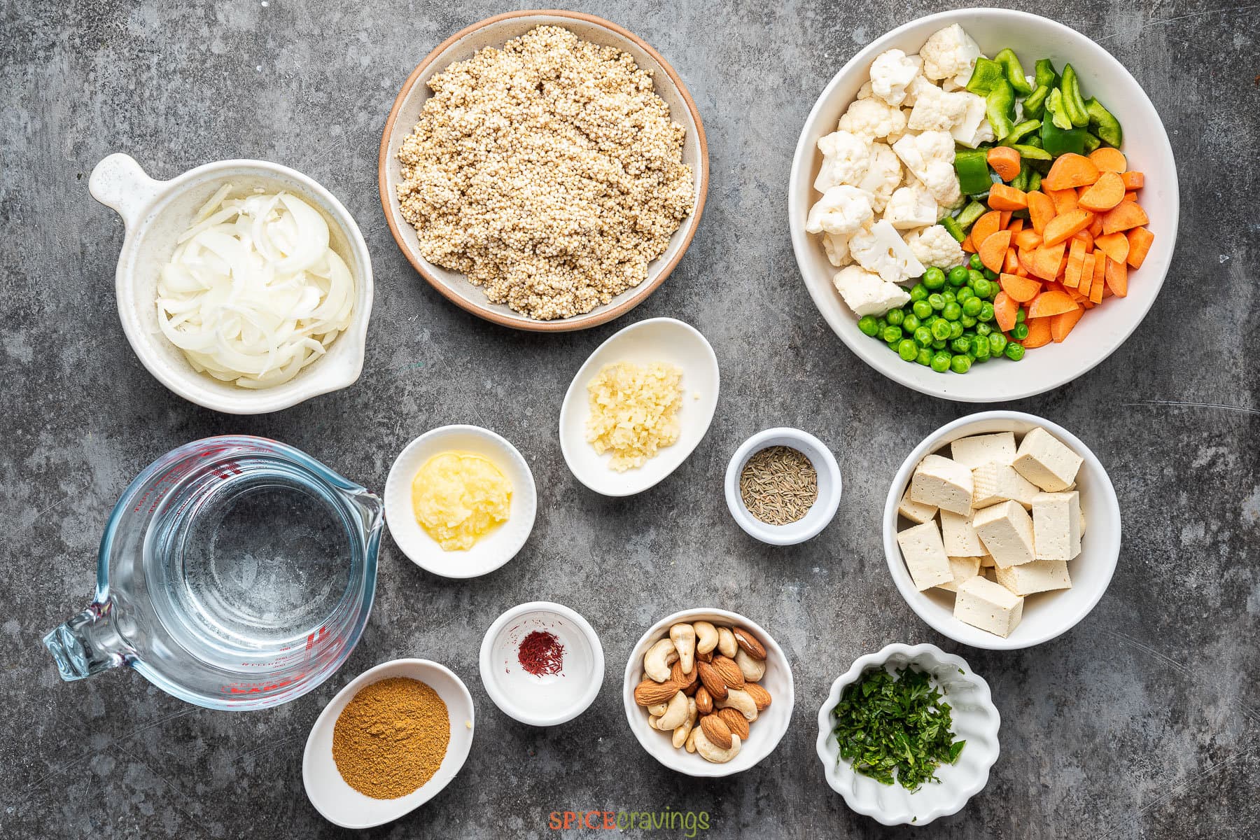 Onions, quinoa, vegetables, tofu among other ingredients for making quinoa biryani