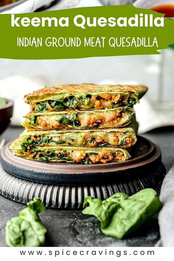 Quesadilla quarters stacked, filled with cheese, meat and spinach