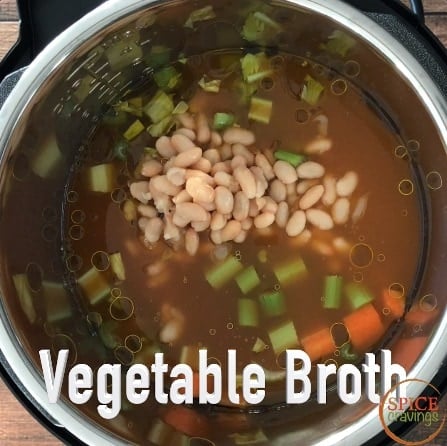 Adding vegetable broth to the pot