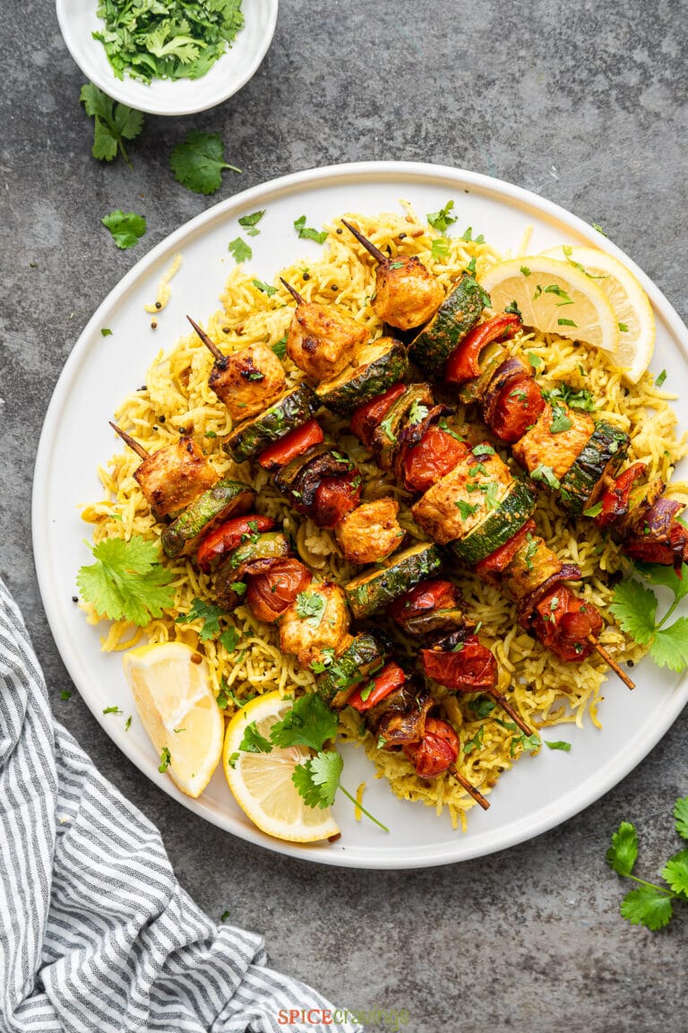 Chicken Skewers and Vegetables on Lemon Rice made in instant pot by Spice Cravings. Chicken and Vegetable skewers are a good combo of protein and vegetables. Chicken is cooked in an instant pot & served with a side of saffron rice. #food #foodie #foodblogger #delicious #recipe #instantpot #recipes #easyrecipe #cuisine #30minutemeal #instagood #foodphotography #tasty