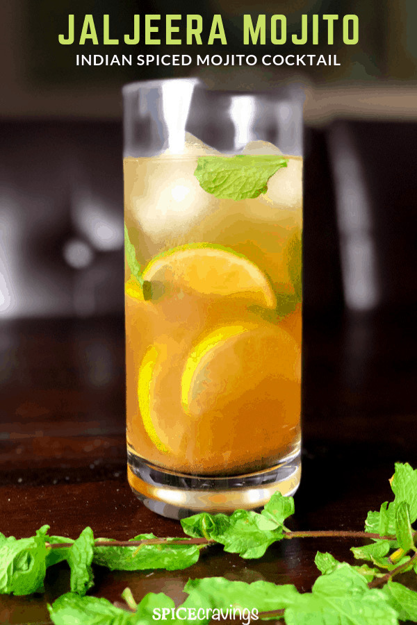 A tall glass of chilled Indian spiced Mojito Cocktail, called JalJeera Mojito