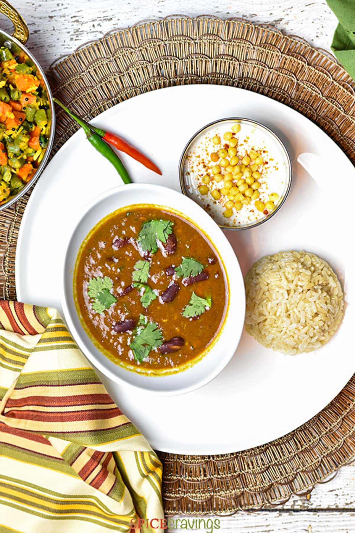 Rajma masala served with brown rice and boondi raita