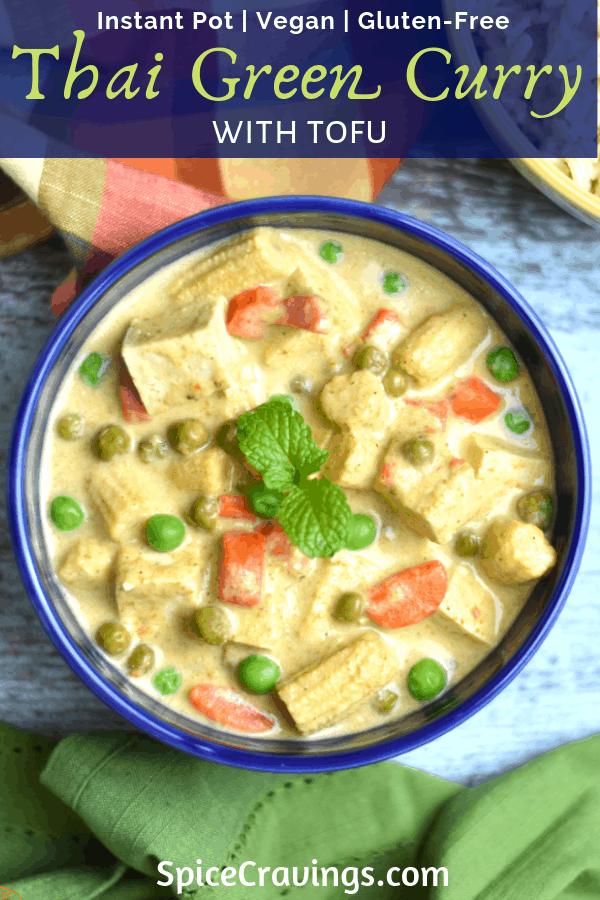 Thai green curry with peas, baby corn and tofu served in a blue bowl