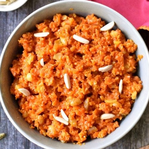 Delicious Indian dessert, Carrot halwa,made in the Instant Pot, garnished with slivered almonds.