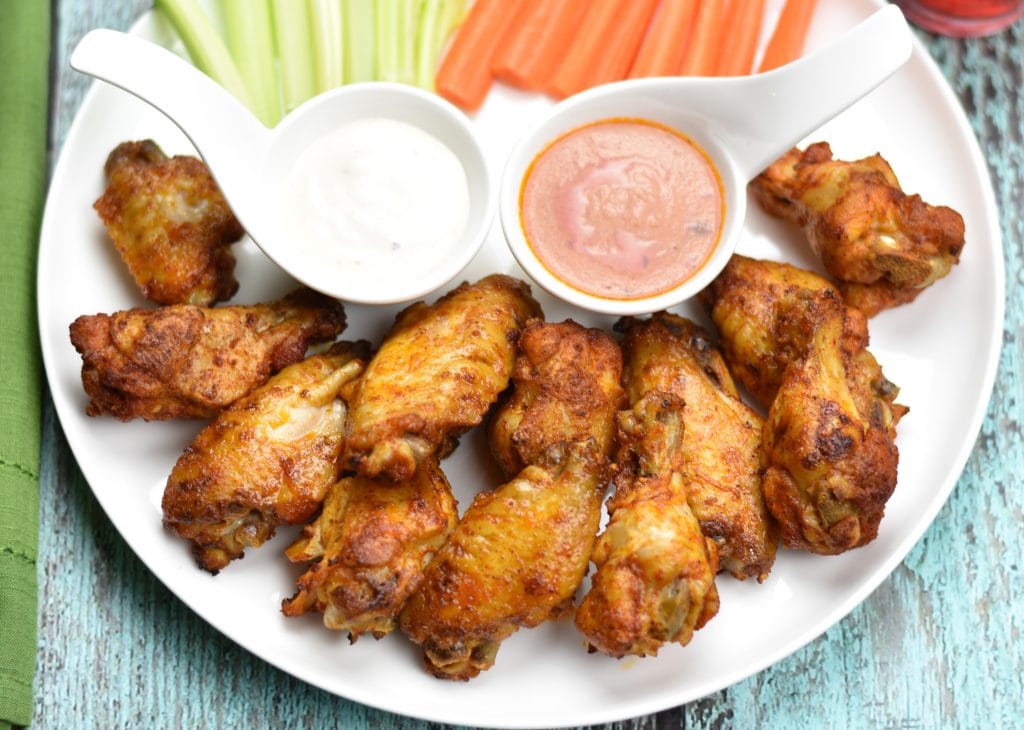 Instant pot Buffalo Chicken wings, Oven Baked wings by Spice Cravings. If you're hosting a game-day party or Superbowl, you need three things- good beer, a great TV, and Buffalo Chicken Wings!!  These wings are spice rubbed, oven baked, or cooked in the Instant Pot, coated with spicy and delicious Buffalo sauce and grilled for a final tasty finish! #food #foodie #foodblogger #delicious #recipe #instantpot #recipes #easyrecipe #cuisine #30minutemeal #instagood #foodphotography #tasty 
