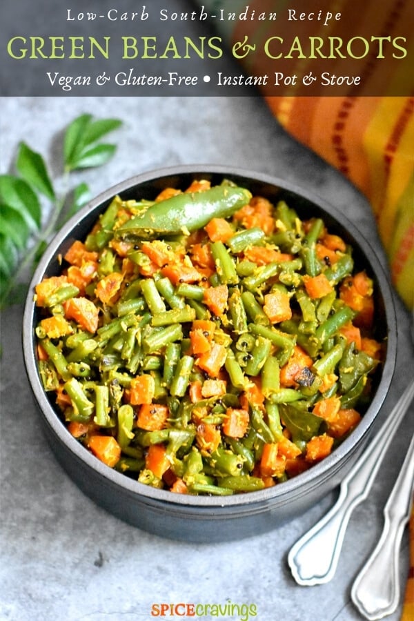 Green Beans and Carrots served in a black bowl with curry leaves on the side