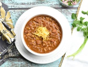Instant Pot Chicken Chili, By Spice Cravings. This is a spicy, tasty, quick 'n' easy, and healthier chicken chili recipe. Made with ground chicken, taco seasoning and creamy pinto beans, you'll love this protein and fiber packed warm bowl of goodness, on a cold, winter night too. #food #foodie #foodblogger #delicious #recipe #instantpot #recipes #easyrecipe #cuisine #30minutemeal #instagood #foodphotography #tasty