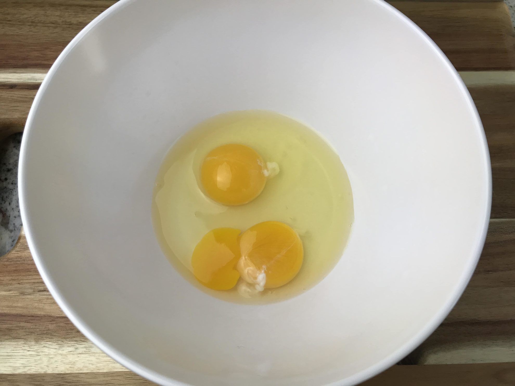 3 eggs in a mixing bowl