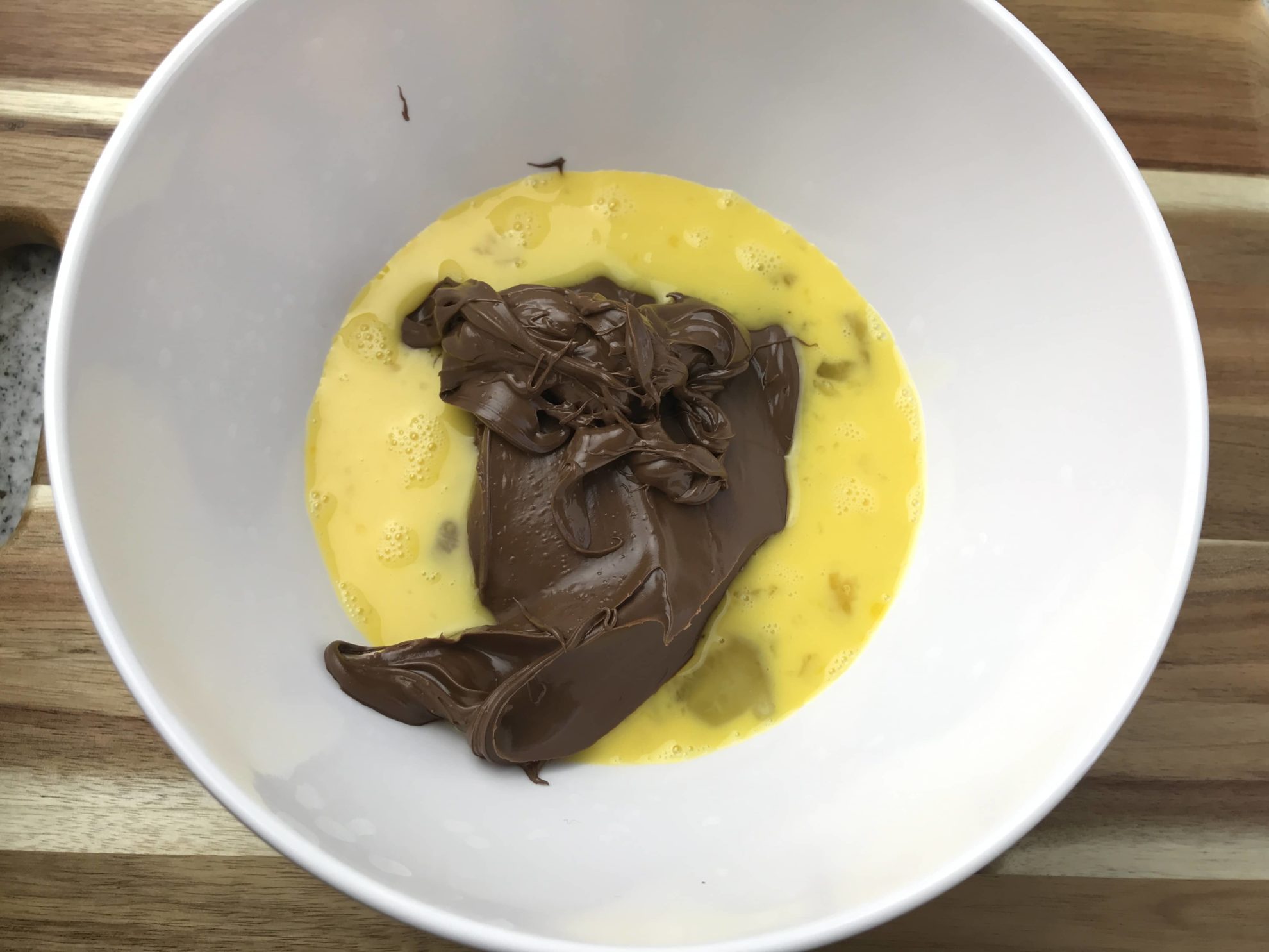 Nutella spread in bowl with eggs