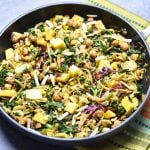 Kale mango slaw with chickpeas, made by sauteing kale slaw mix (from Trader Joe’s), with chickpeas, juicy mango, and topped with crunchy slivered almonds. by Spice Cravings. #cooking #food #recipe #recipes #foodphotography #foodblogger #yummy #delicious #foodie