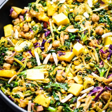 Kale, chickpeas and mango salad in skillet