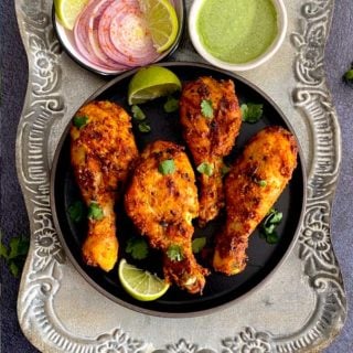 Tandoori Chicken Recipe, with chicken marinated in yogurt, lemon juice, aromatics and bold Indian spices. By Spice Cravings. #cooking #food #recipe #recipes #foodphotography #foodblogger #yummy #delicious #foodie