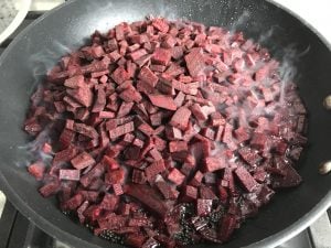 diced red beets in nonstick skillet