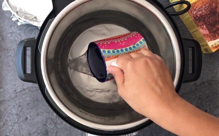 Adding water to the cooking pot of Instant pot