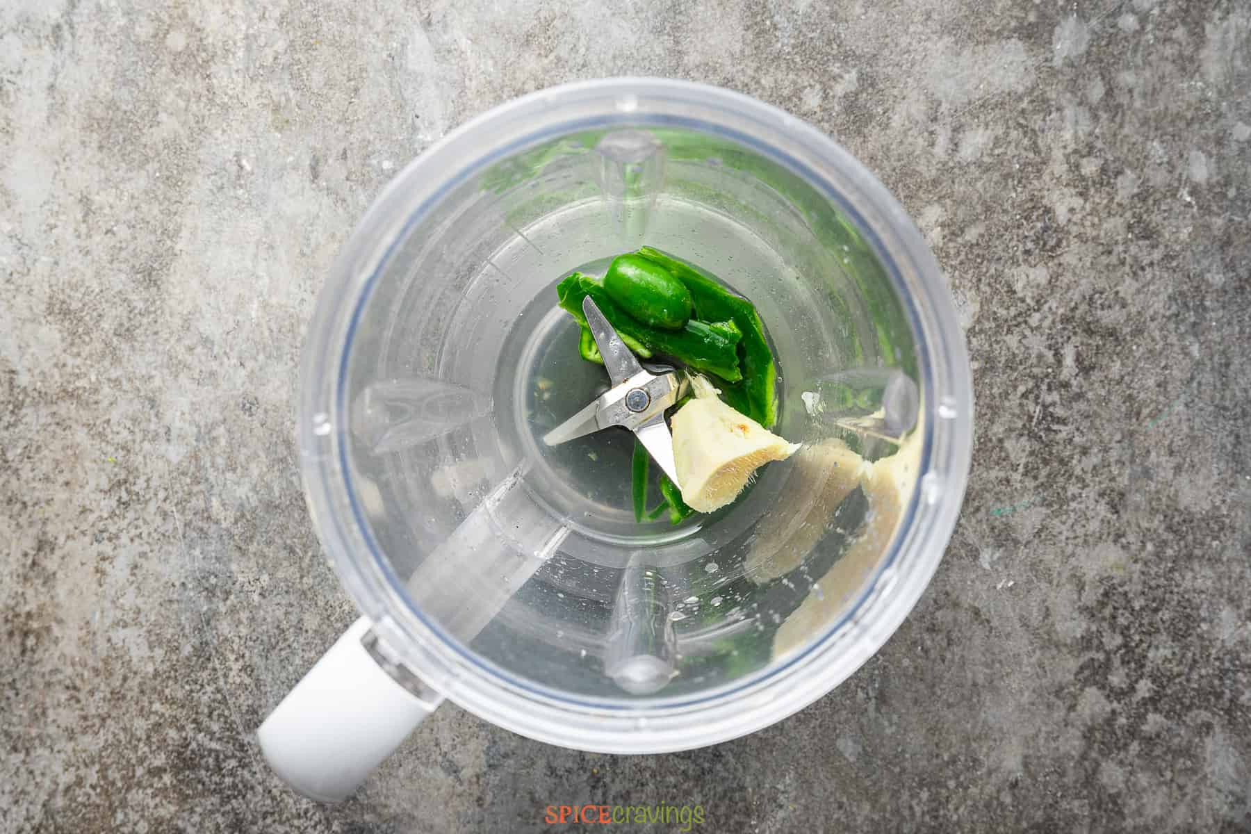 Green chilies and ginger in the blender jar