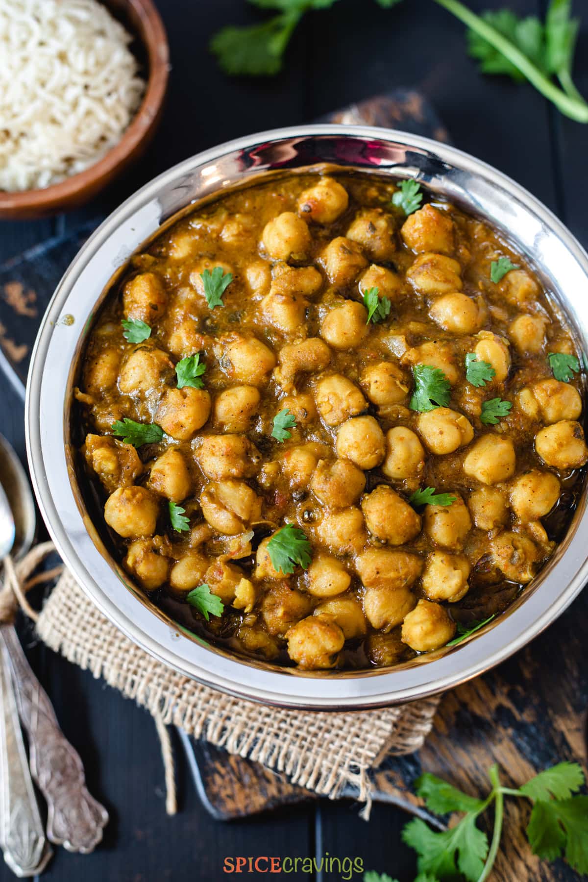 close up of instant pot chana masala served in a black bowl