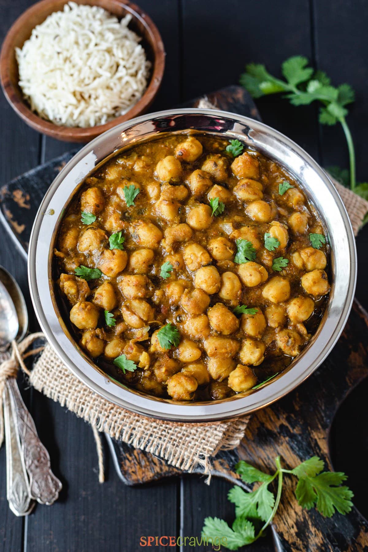 chickpeas curry served in stainless steel bowl