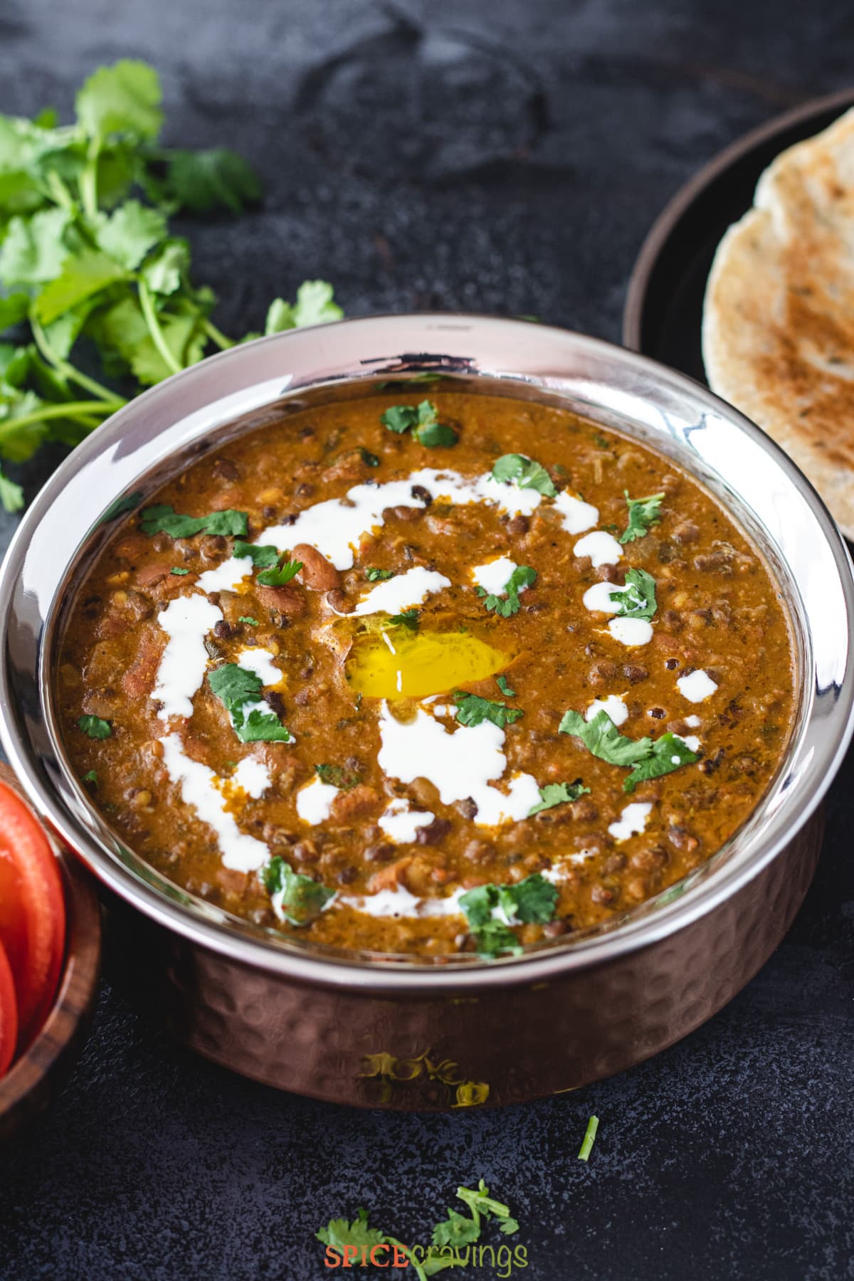 An image of Instant Pot Dal Makhani with a side of Naan and rice