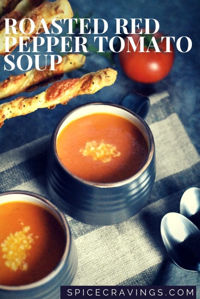 Roasted red pepper soup garnished with grated parmesan cheese