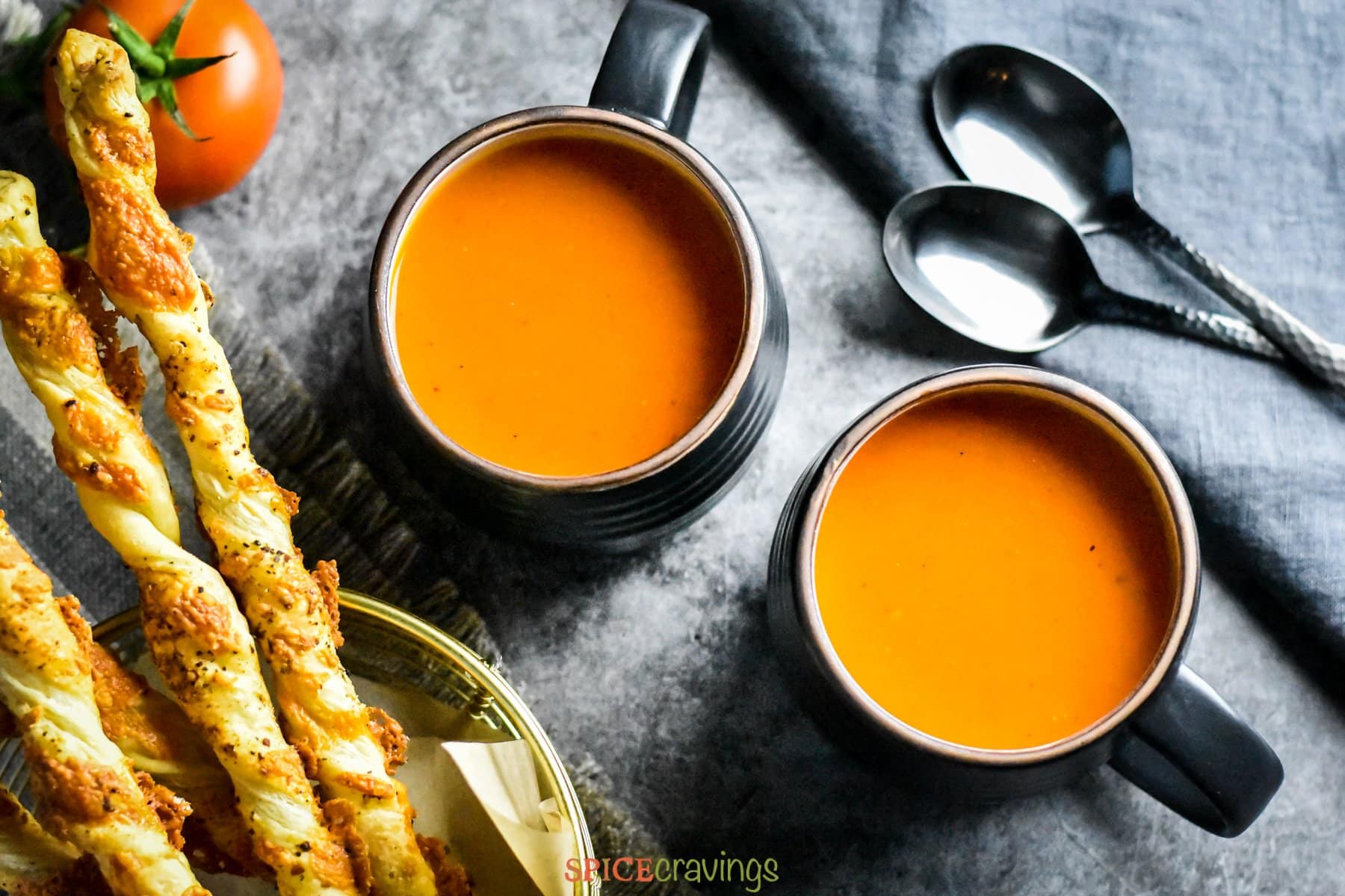 Roasted Red Pepper Tomato Soup served with cheese straws