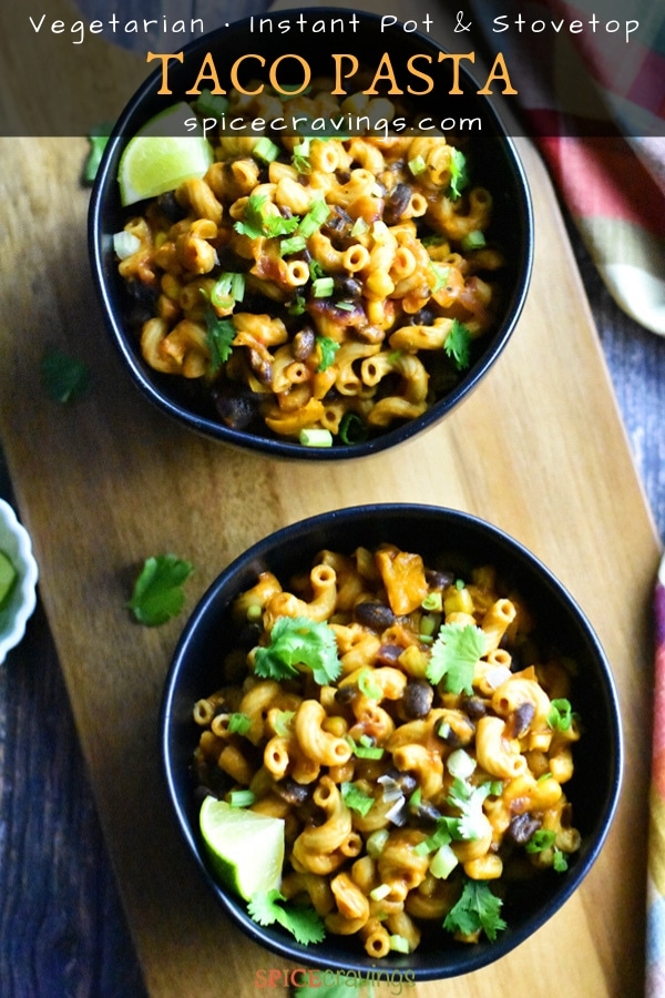 Two Bowls of cheesy taco pasta with black beans and corn