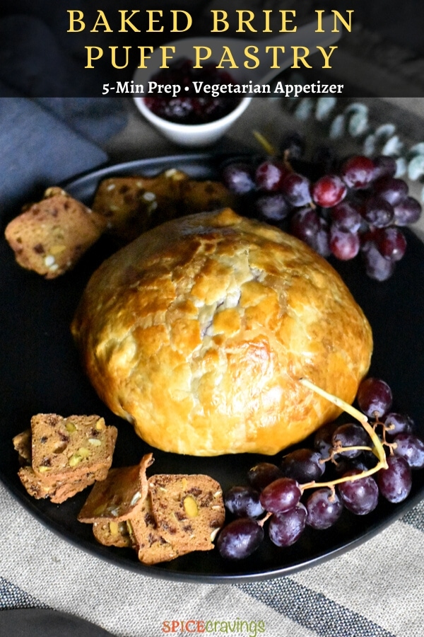 Golden Crispy Baked Brie with grapes and crackers on the side