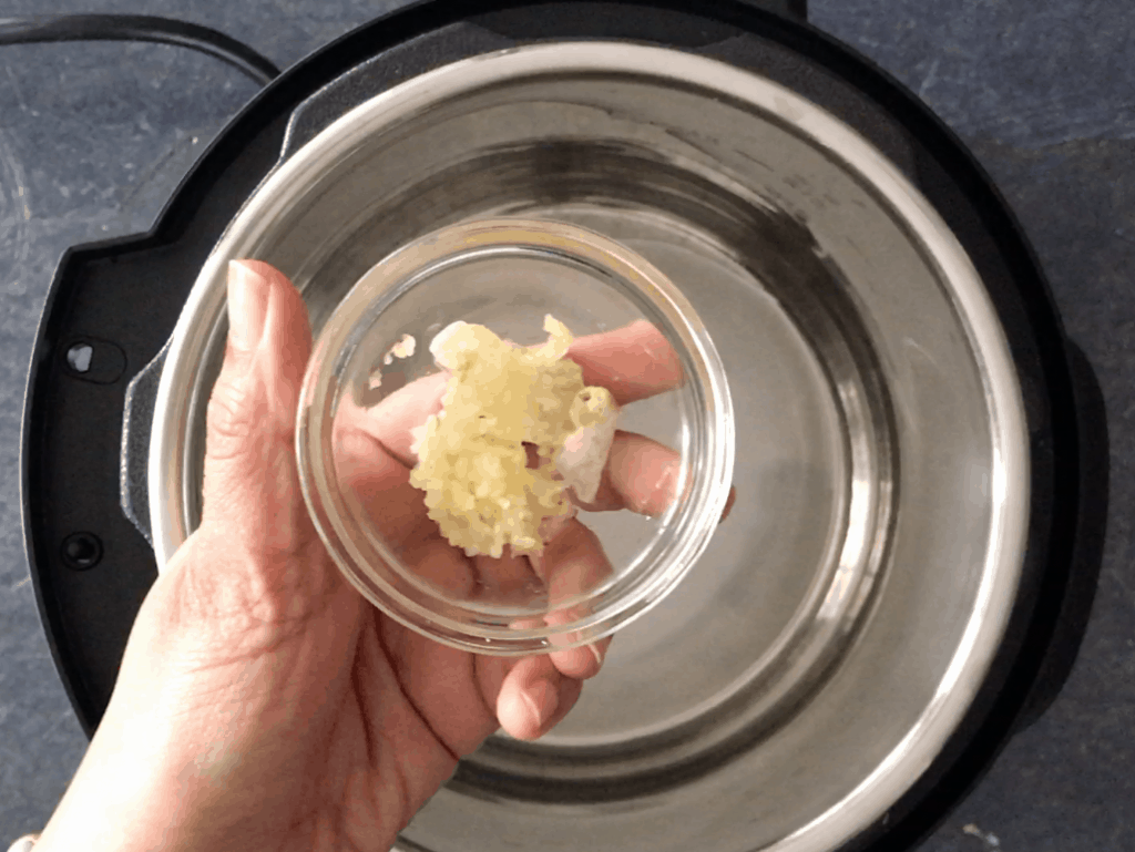 Adding garlic to the oil in the Instant Pot