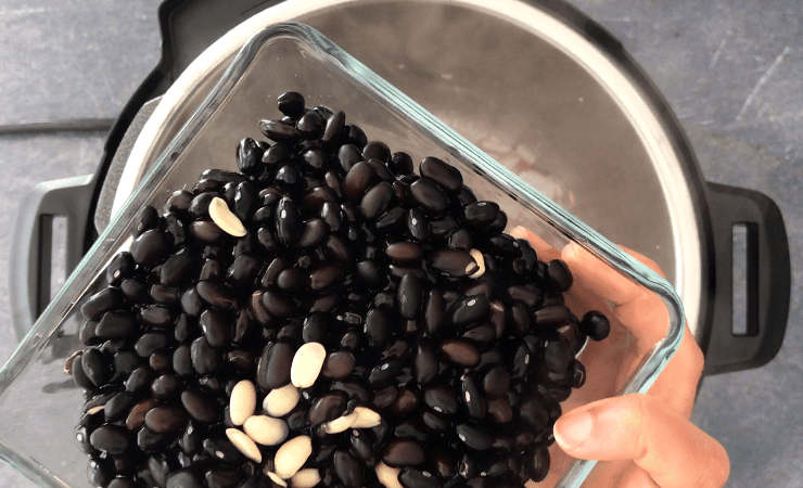 Adding soaked and drained black beans to the Instant Pot