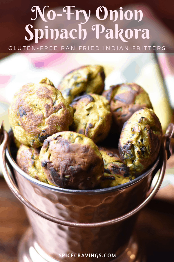 No Fry Onion Spinach Pakora, or Indian fritters, served in a rustic copper bowl
