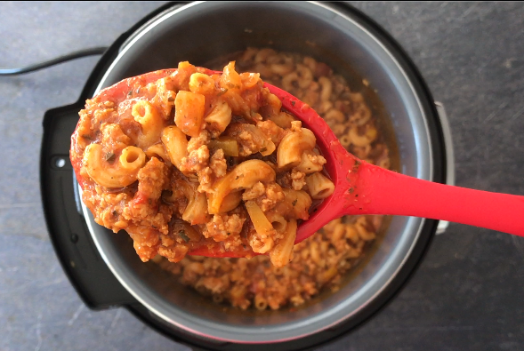 A spoonful of delicuous Goulash with pasta and ground meat