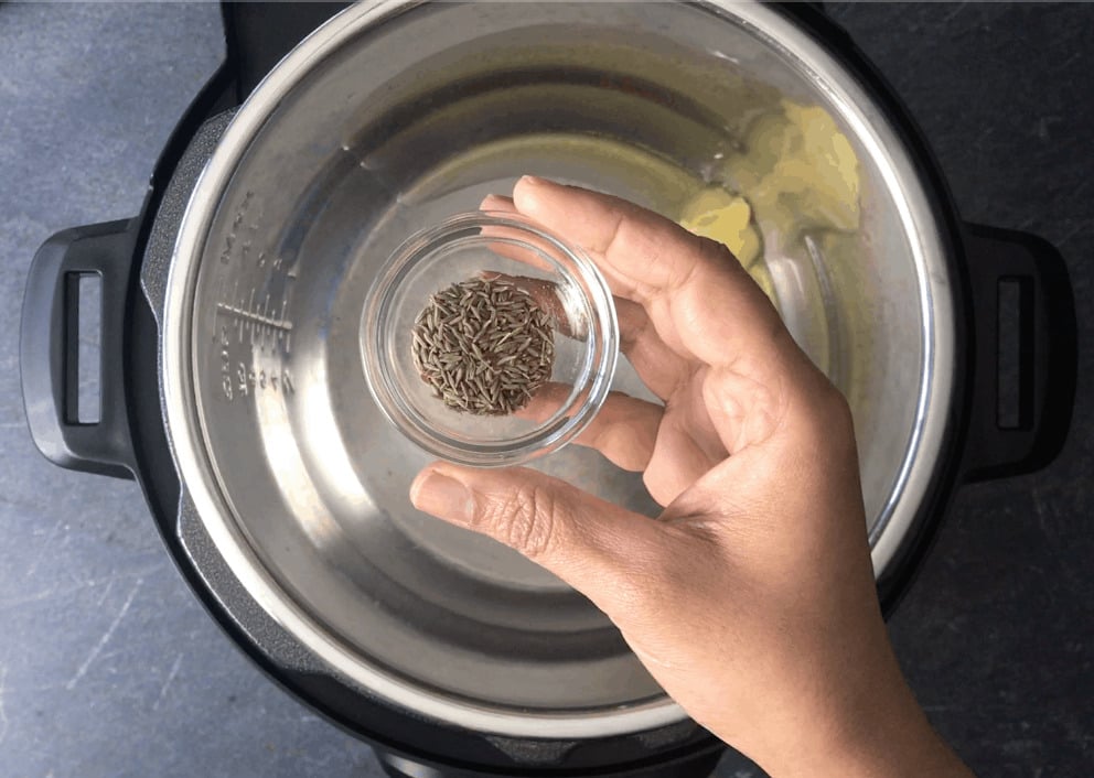 Adding cumin seeds to melted ghee in instant pot