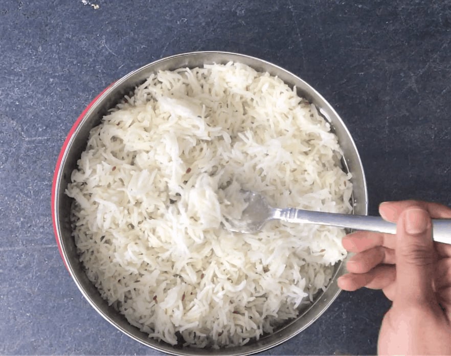 Fluffing rice with a fork