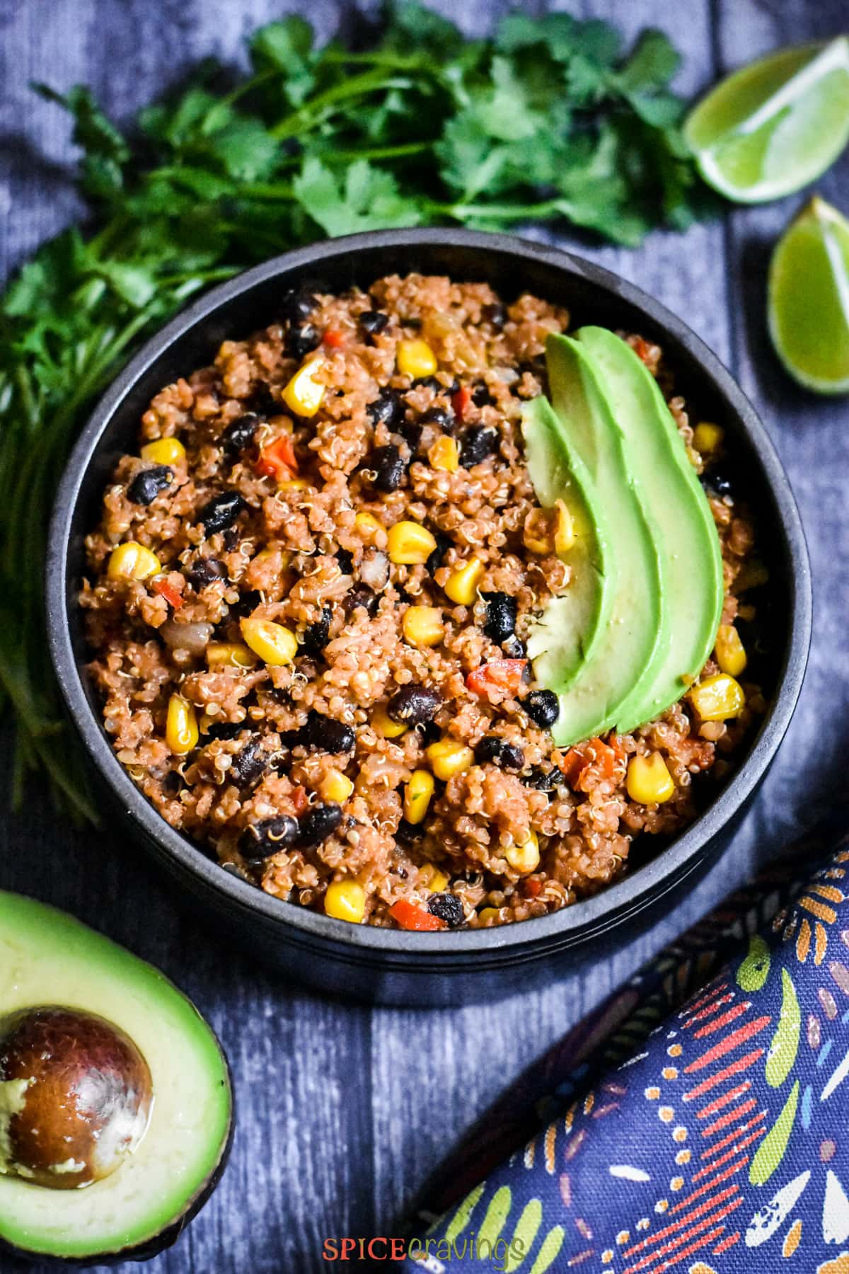 Mexican Quinoa burrito bowl with sliced avocado