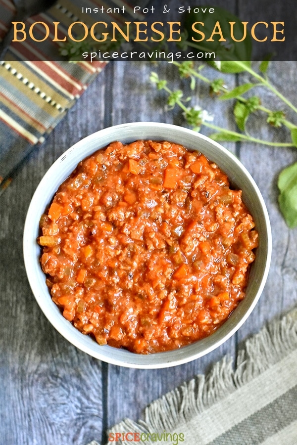 Chunky bolognese sauce served in a grey bowl