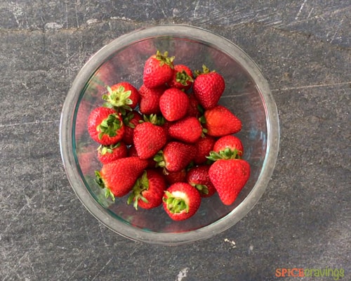 fresh strawberries in a glass bowl