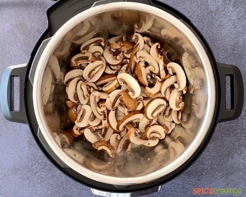 Sliced mushrooms, celery and onion being sautéed in the Instant Pot