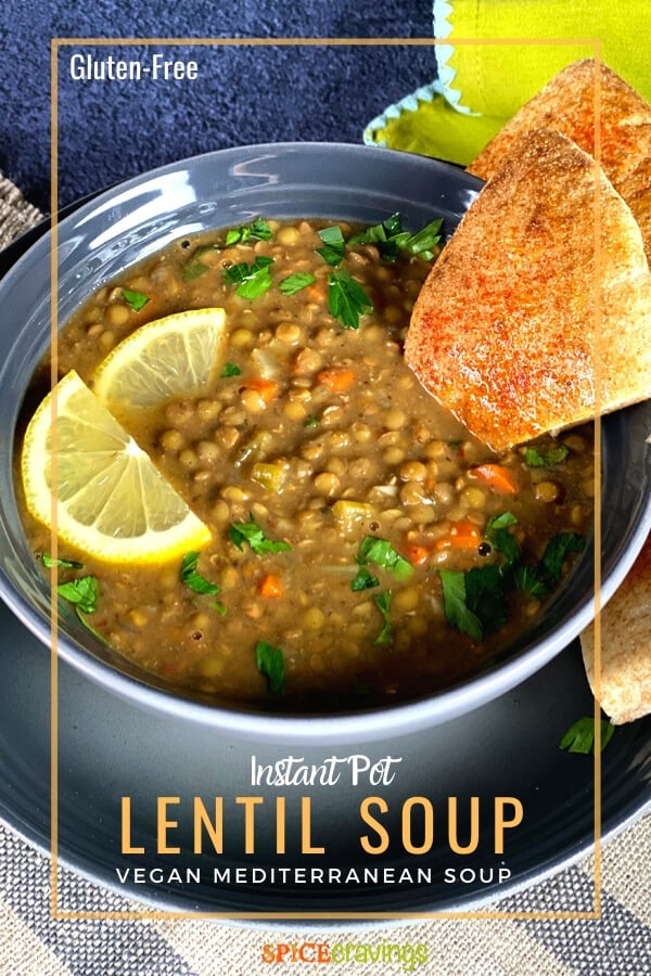 instant pot lentil soup in gray bowl garnished with lemon slices and pita bread
