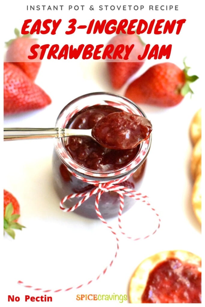 3-ingredient strawberry jam in glass jar with silver spoon and fresh strawberries