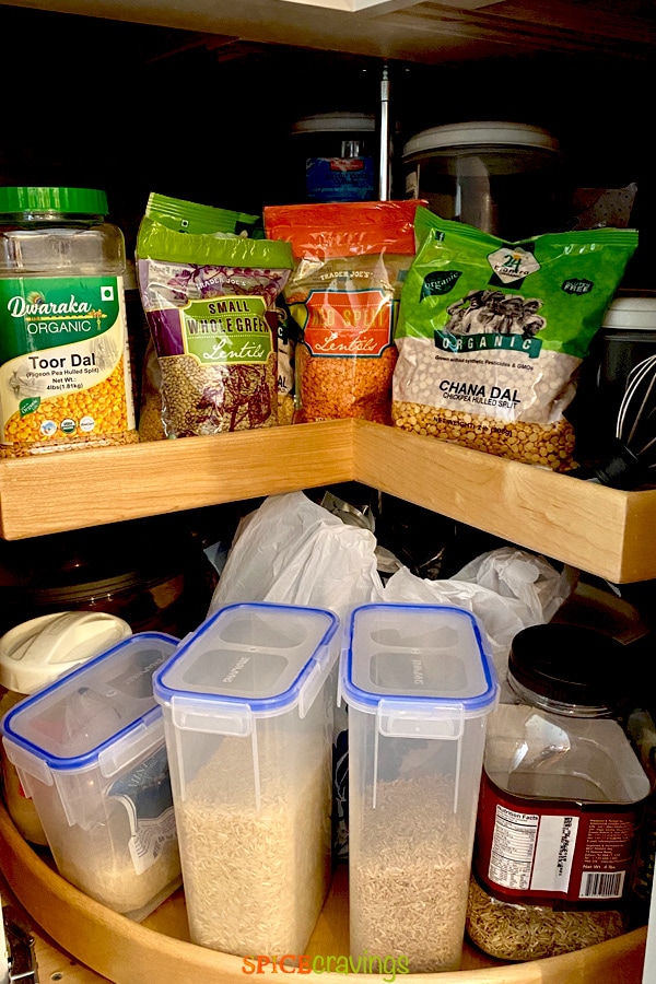 An assortment of lentils and rice stocked in a pantry
