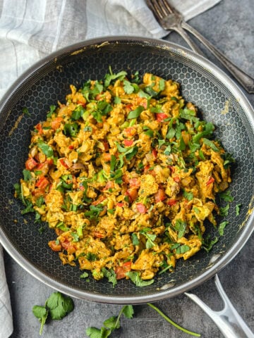 Indian scrambled eggs called egg bhurji recipe in non-stick skillet