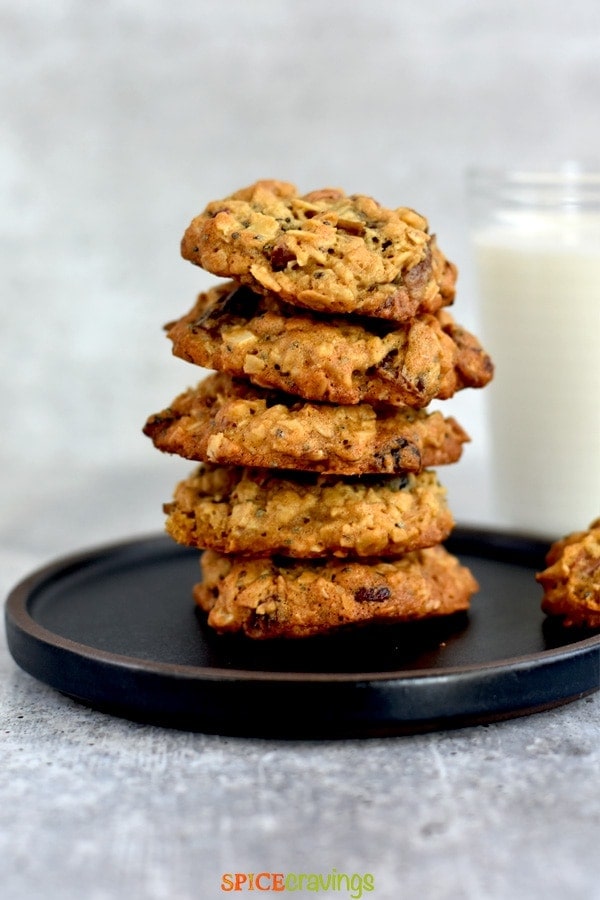 stack of soft and chewy cookies with glass of milk