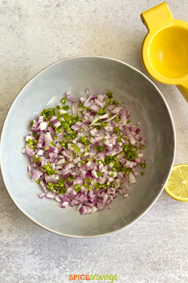 Bowl with chopped onion and serrano pepper
