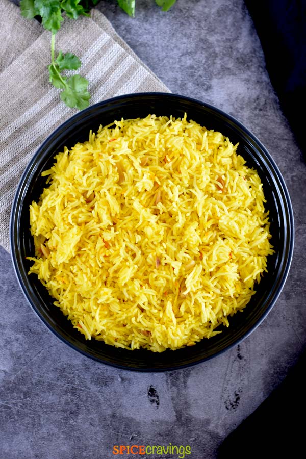easy rice pilaf with saffron in black bowl
